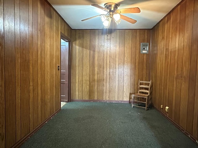 113 Butler St, Lufkin, TX 75904 - unfurnished room with carpet flooring, wood walls, and a ceiling fan