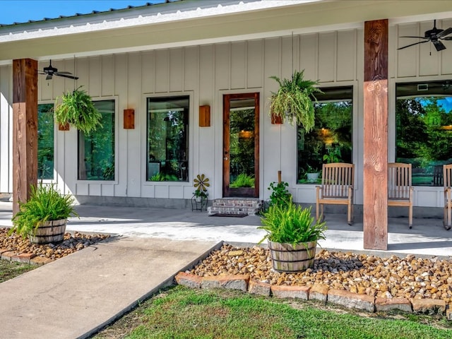 doorway to property featuring a porch and ceiling fan