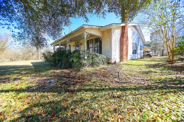 view of property exterior with covered porch