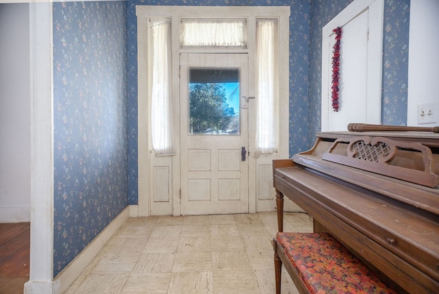 entryway featuring wallpapered walls