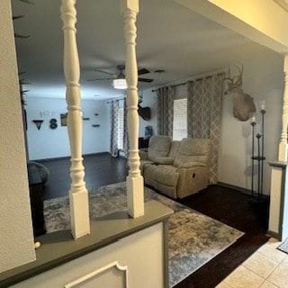 interior space with ceiling fan and tile patterned floors