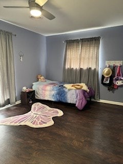 bedroom with baseboards, a ceiling fan, and wood finished floors