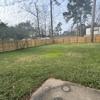 view of yard with a fenced backyard