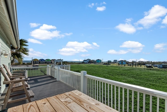 wooden deck with a yard