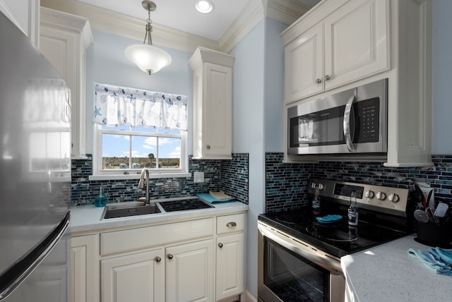 kitchen with white cabinetry, sink, backsplash, appliances with stainless steel finishes, and ornamental molding