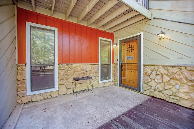 doorway to property with stone siding