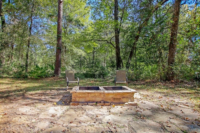 view of patio / terrace featuring a fire pit