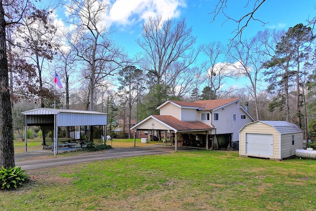 210 Cedar Rdg, Hemphill, TX 75948 - view of yard featuring aphalt driveway, an outbuilding, and a storage shed