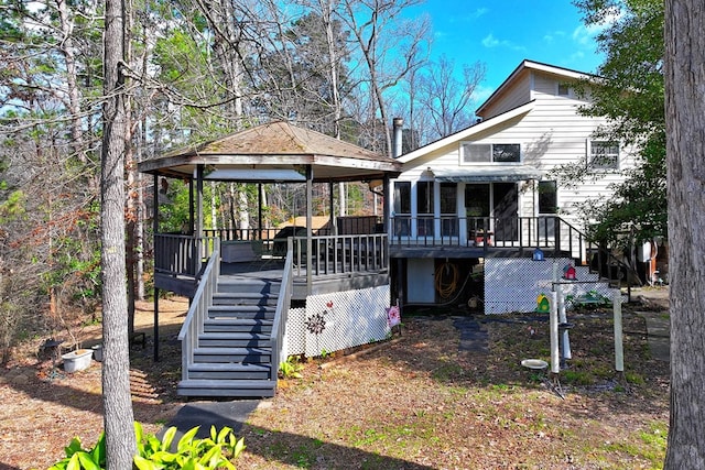 210 Cedar Rdg, Hemphill, TX 75948 - exterior space featuring a wooden deck, stairs, and a sunroom
