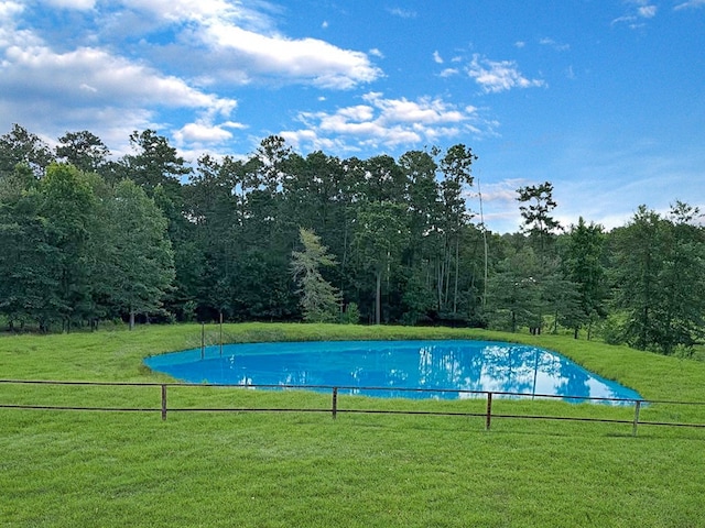 341 Red Wolf Ln, Brookeland, TX 75931 - outdoor pool featuring a view of trees