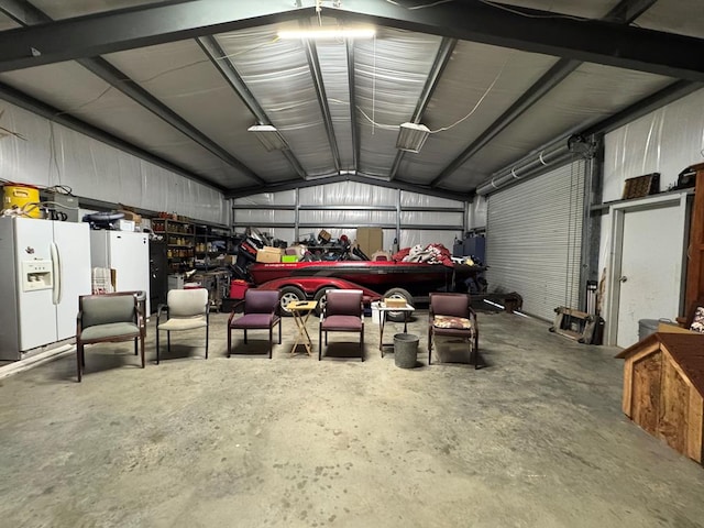 341 Red Wolf Ln, Brookeland, TX 75931 - garage featuring white fridge with ice dispenser