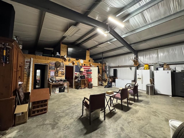 341 Red Wolf Ln, Brookeland, TX 75931 - garage with white refrigerator with ice dispenser, a workshop area, refrigerator, and water heater