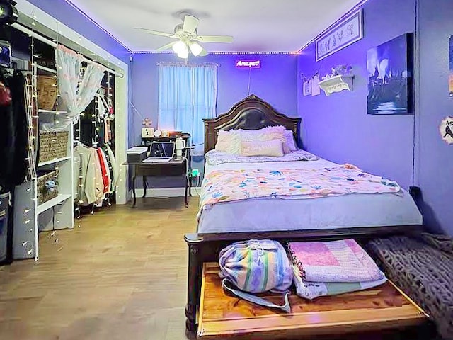 341 Red Wolf Ln, Brookeland, TX 75931 - bedroom with wood finished floors and a ceiling fan