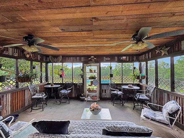 341 Red Wolf Ln, Brookeland, TX 75931 - sunroom with ceiling fan and outdoor dining area