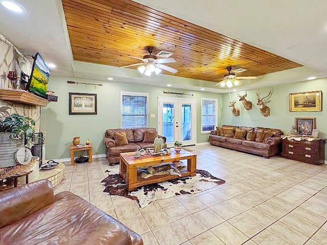 341 Red Wolf Ln, Brookeland, TX 75931 - living room featuring a tray ceiling, wood ceiling, ceiling fan, light tile patterned flooring, and recessed lighting