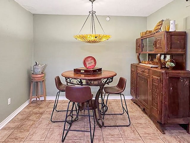 341 Red Wolf Ln, Brookeland, TX 75931 - dining space featuring light tile patterned floors and baseboards