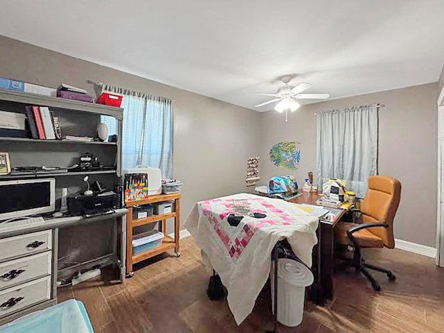 341 Red Wolf Ln, Brookeland, TX 75931 - bedroom featuring wood finished floors, an office area, and ceiling fan
