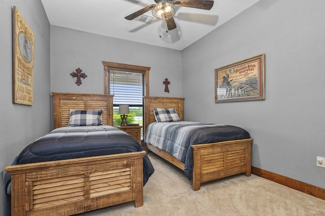 bedroom with ceiling fan and light colored carpet