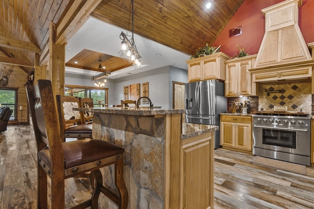 kitchen with wood ceiling, a healthy amount of sunlight, stainless steel appliances, and light wood-type flooring