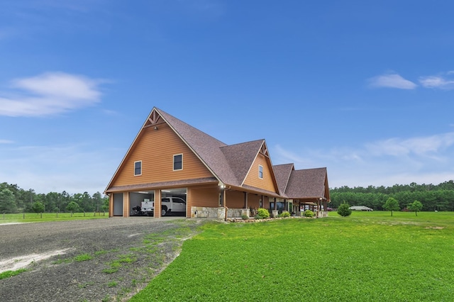 view of front of home with a front yard and a carport