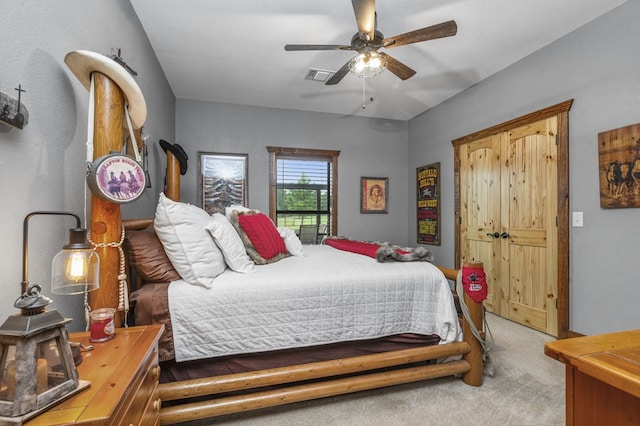 bedroom with ceiling fan and light carpet