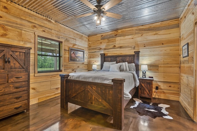 bedroom featuring wood walls and ceiling fan