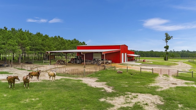 view of community with an outbuilding and a rural view