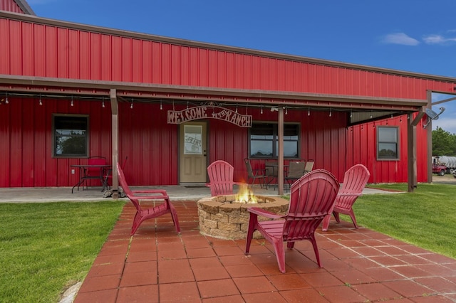 view of patio / terrace with a fire pit