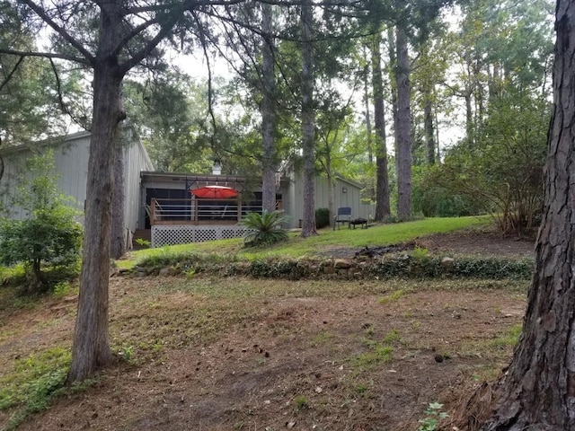 view of yard with a wooden deck