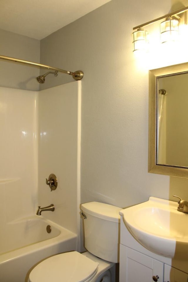 full bathroom with vanity, shower / bathtub combination, and toilet