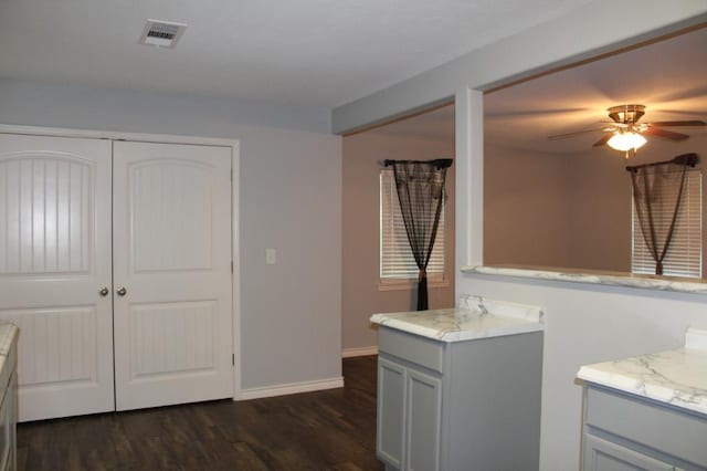 bathroom with hardwood / wood-style floors and ceiling fan