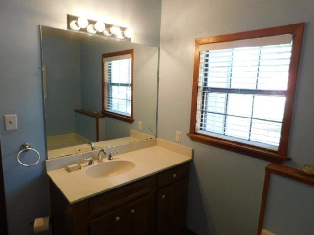 bathroom with vanity and a healthy amount of sunlight