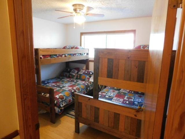 bedroom featuring hardwood / wood-style floors and ceiling fan