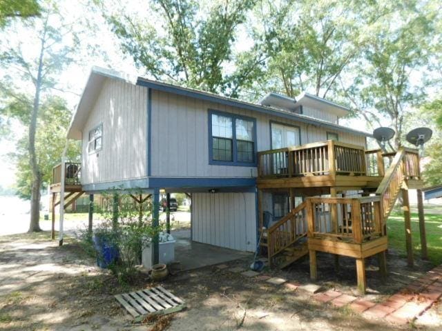 rear view of property with a wooden deck