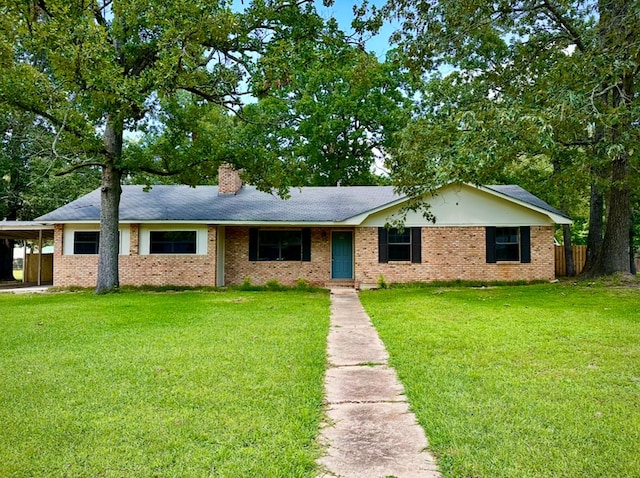 213 Crosstimbers St, Lufkin, TX 75904 - ranch-style house with a chimney, brick siding, a carport, and a shingled roof