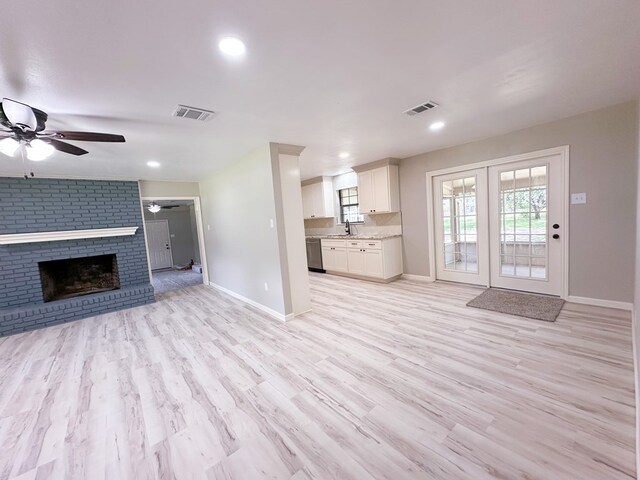 213 Crosstimbers St, Lufkin, TX 75904 - unfurnished living room featuring baseboards, a ceiling fan, light wood-style floors, and recessed lighting
