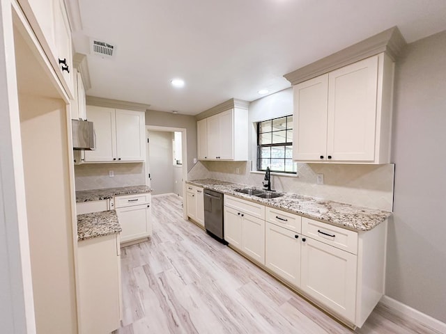 213 Crosstimbers St, Lufkin, TX 75904 - kitchen featuring stainless steel dishwasher, a sink, baseboards, recessed lighting, and light stone counters