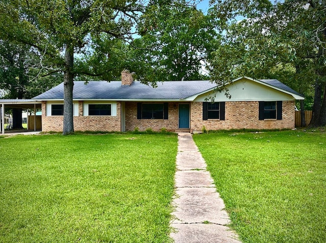 213 Crosstimbers St, Lufkin, TX 75904 - ranch-style home with a chimney, brick siding, and an attached carport
