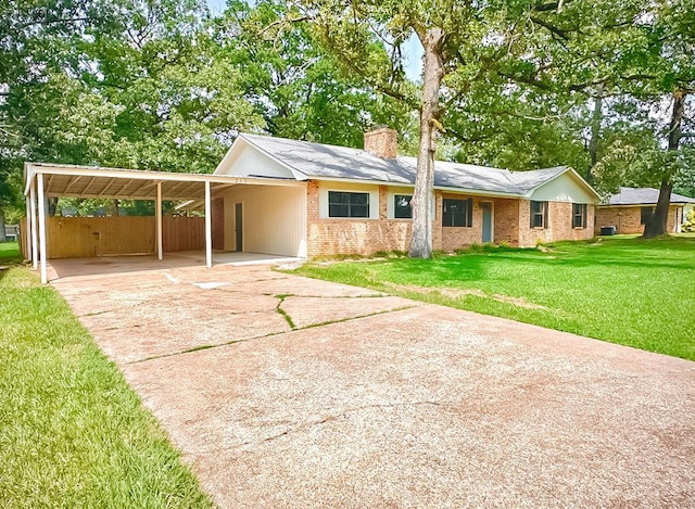 213 Crosstimbers St, Lufkin, TX 75904 - single story home featuring a chimney, driveway, brick siding, and an attached carport
