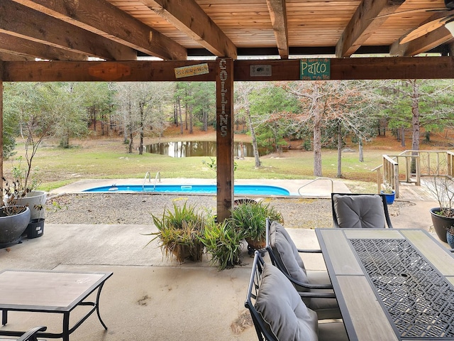 outdoor pool featuring a yard, a patio, and a gazebo