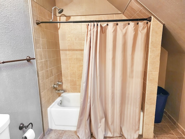 bathroom featuring shower / bath combination with curtain and tile patterned floors