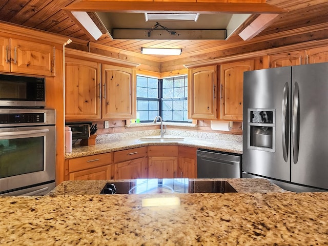 kitchen with stainless steel appliances, wooden ceiling, a sink, and light stone countertops