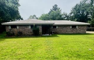 1708 Allendale Dr, Lufkin, TX 75904 - back of property with a lawn