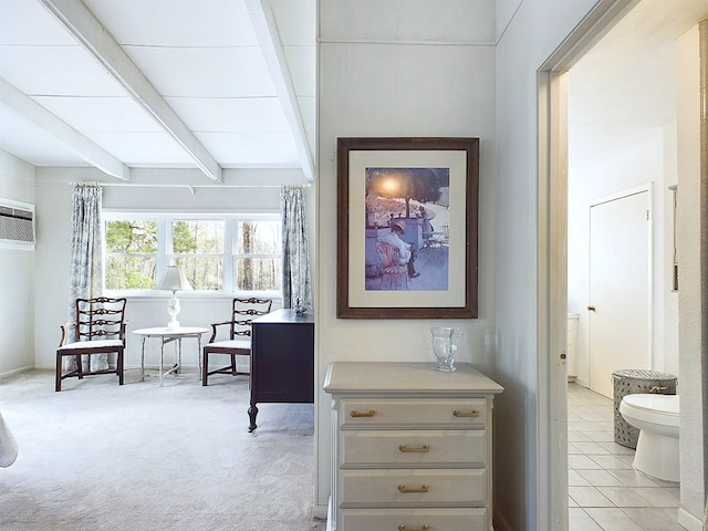 hallway with beamed ceiling, light colored carpet, and a wall unit AC