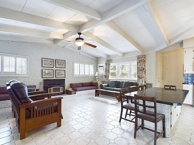 living room with vaulted ceiling with beams and ceiling fan