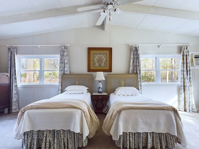 carpeted bedroom featuring vaulted ceiling with beams and ceiling fan