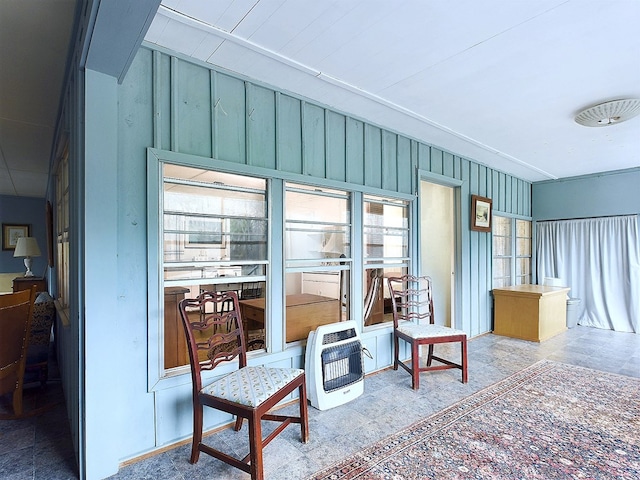 sunroom featuring heating unit