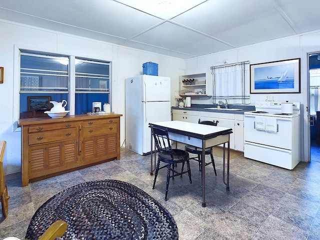 kitchen with white appliances and sink