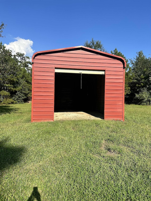 garage with a yard