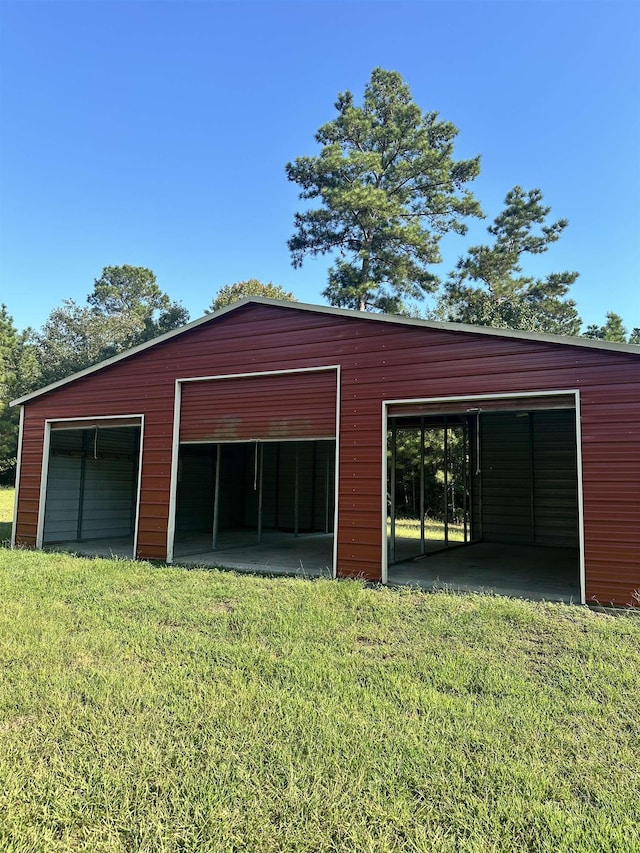 garage featuring a yard